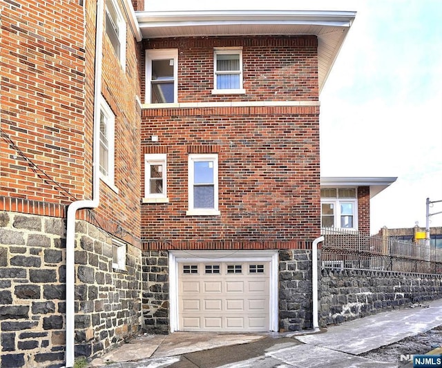 view of side of home with a garage