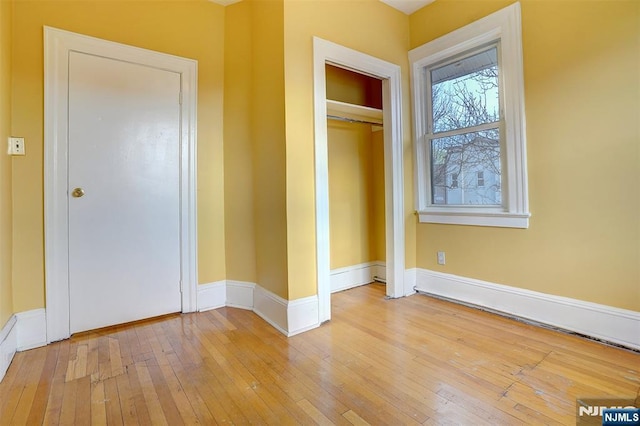 unfurnished bedroom featuring light hardwood / wood-style floors