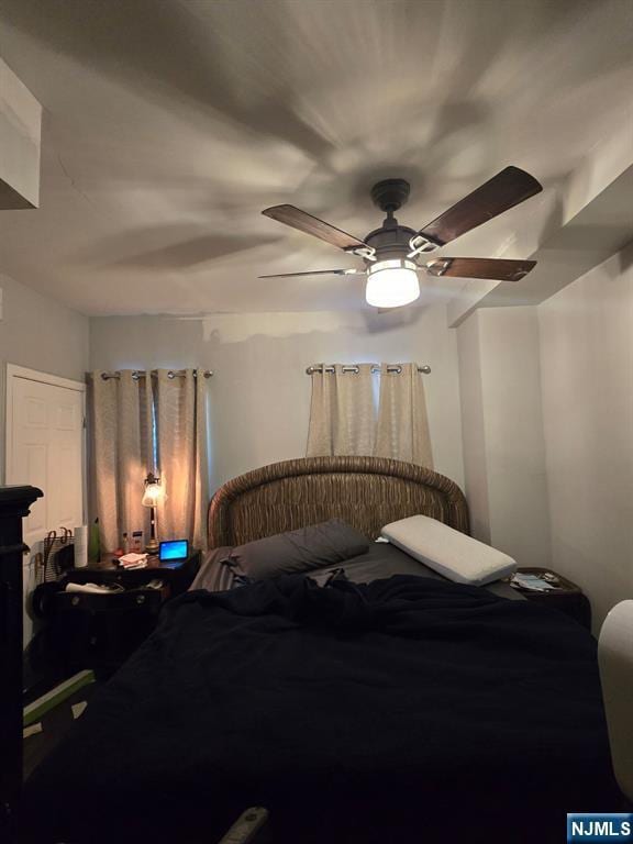 bedroom featuring ceiling fan