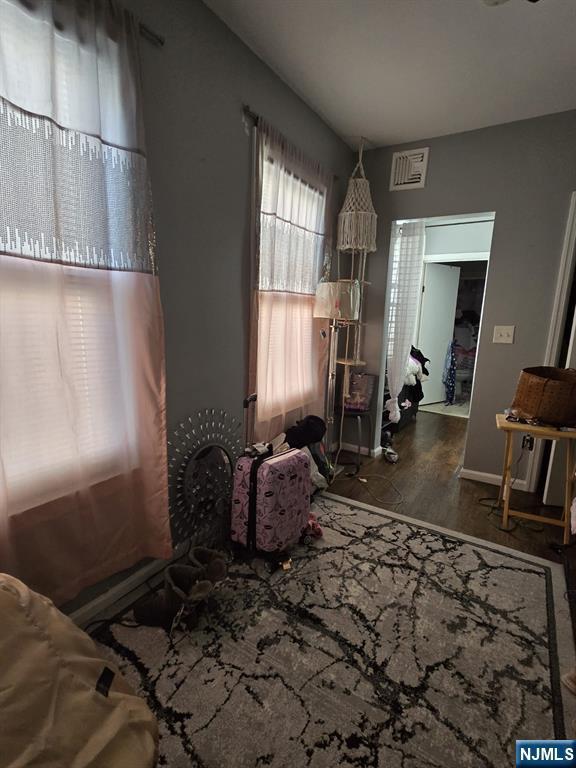 bedroom with hardwood / wood-style flooring