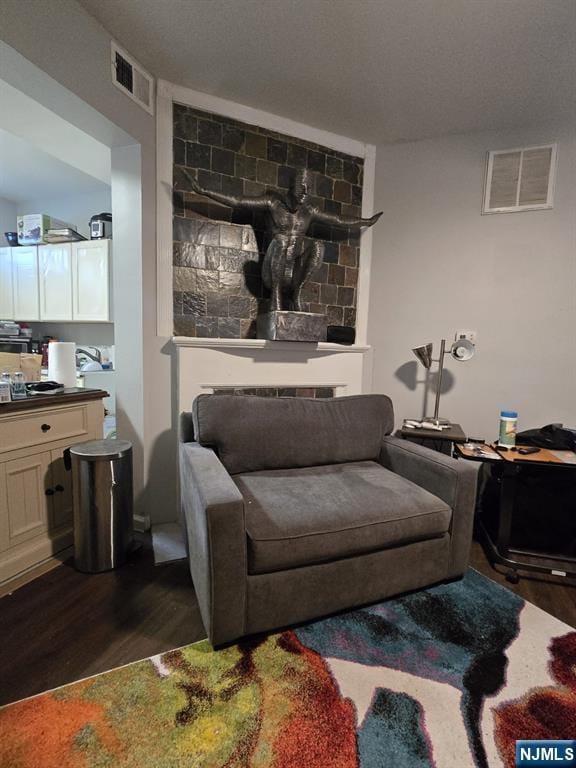 living room with dark hardwood / wood-style floors