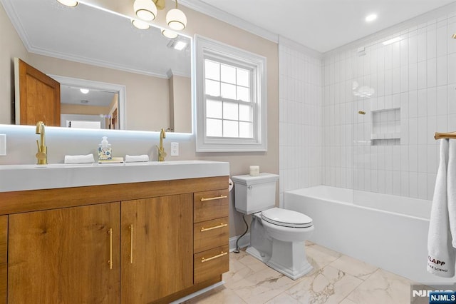 full bathroom featuring ornamental molding, toilet, tiled shower / bath combo, and vanity