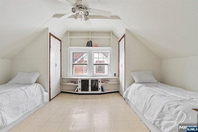 bedroom with lofted ceiling and ceiling fan