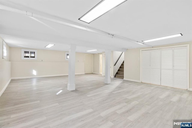 basement featuring light hardwood / wood-style floors