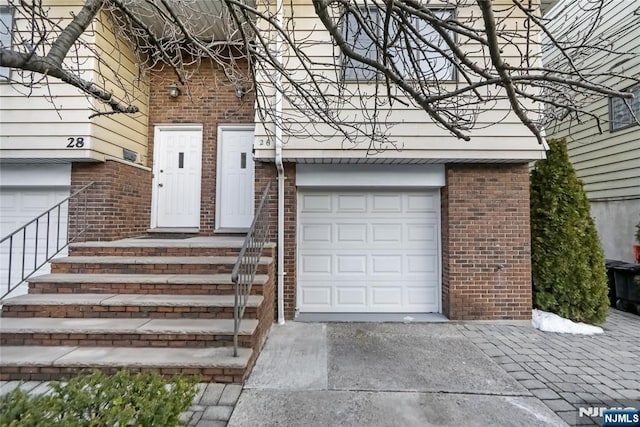 doorway to property featuring a garage