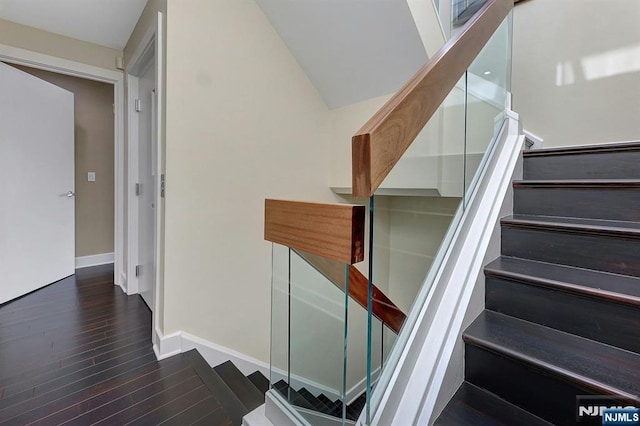 stairway featuring hardwood / wood-style flooring