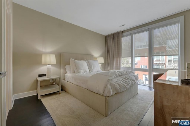 bedroom with light hardwood / wood-style flooring