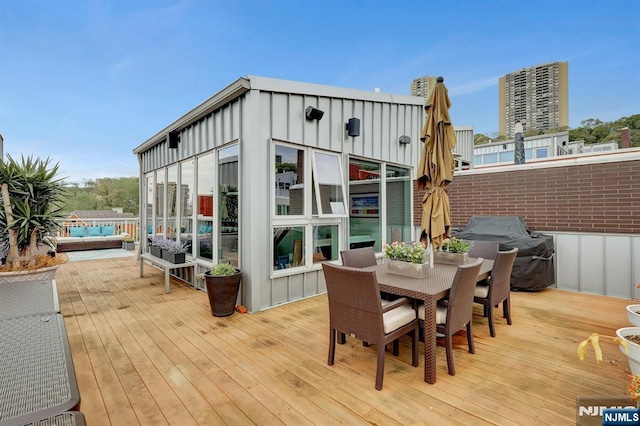 wooden deck featuring grilling area