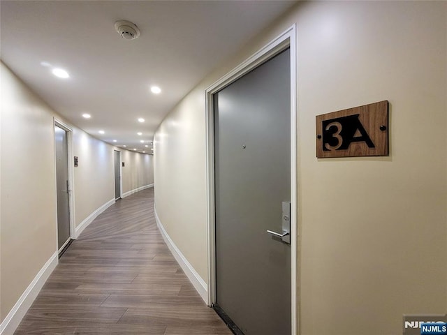 hall with dark wood-type flooring