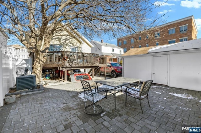 view of patio with a wooden deck and central air condition unit