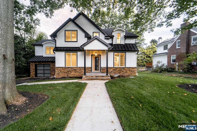 modern inspired farmhouse featuring a front lawn