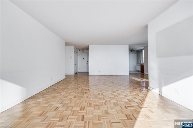 empty room with light parquet floors