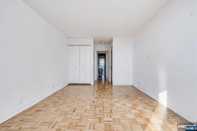 unfurnished room featuring light parquet floors