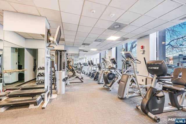 gym featuring a paneled ceiling