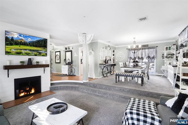 living room with crown molding and a notable chandelier