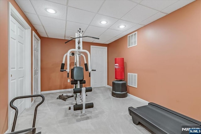 exercise area with carpet and a drop ceiling