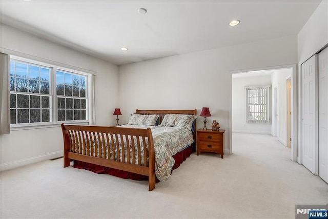 bedroom with light colored carpet