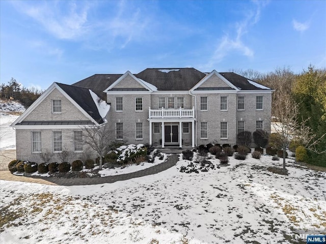 view of front of home with a balcony