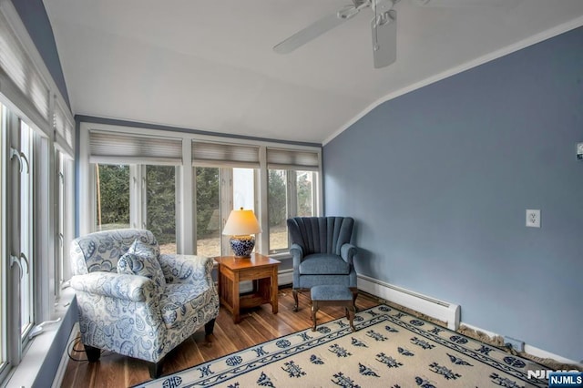 sunroom / solarium with a baseboard radiator, vaulted ceiling, and ceiling fan