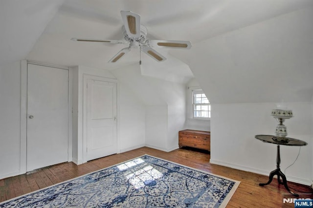 bonus room with lofted ceiling, hardwood / wood-style floors, and ceiling fan