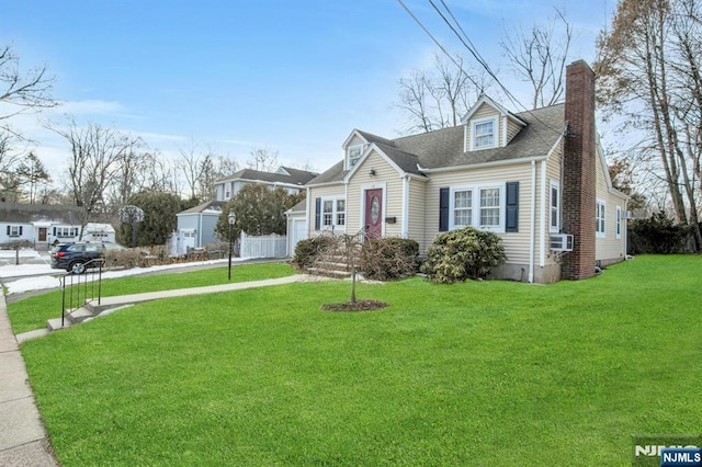 view of front of property featuring a front yard and cooling unit