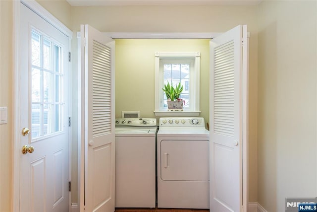 clothes washing area with independent washer and dryer