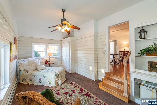 carpeted bedroom featuring ceiling fan and vaulted ceiling