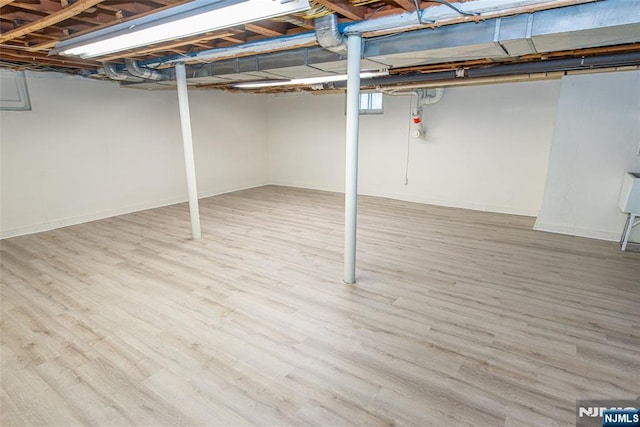 basement featuring light wood-type flooring