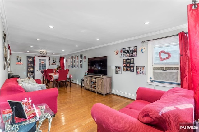 living room featuring hardwood / wood-style floors, crown molding, and baseboard heating