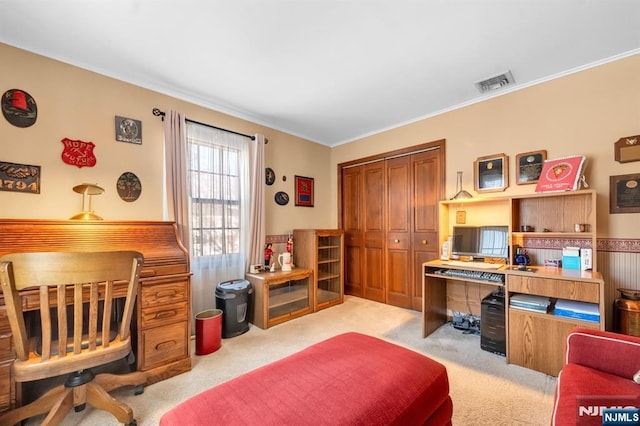 carpeted office with crown molding