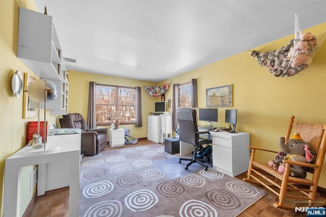 home office with light parquet floors