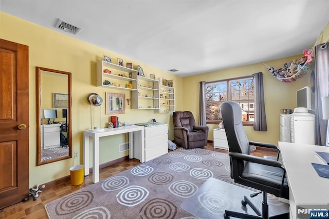 office space featuring parquet flooring