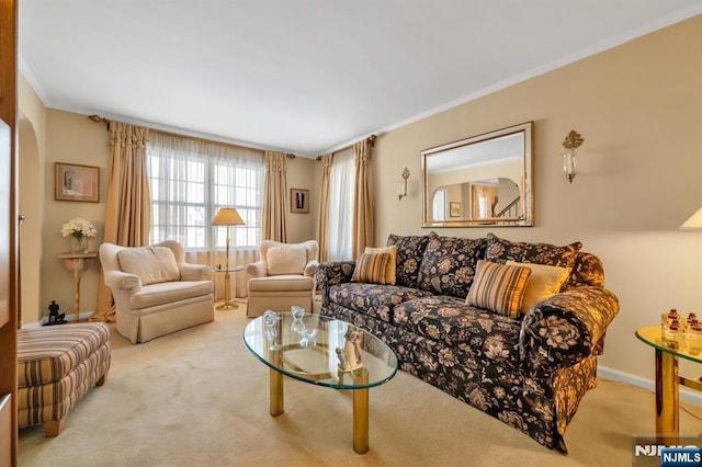 living room with crown molding and light colored carpet