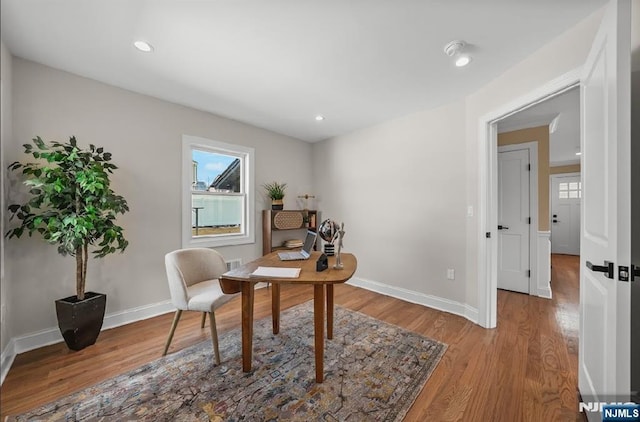 home office featuring hardwood / wood-style floors