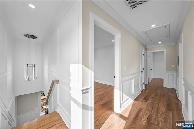 hallway featuring dark wood-type flooring and ornamental molding