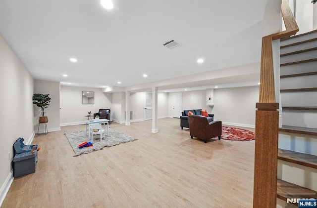 workout area featuring light hardwood / wood-style floors