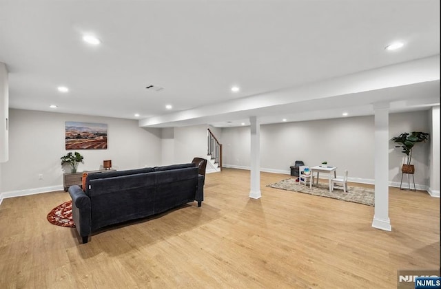 living room with light hardwood / wood-style floors