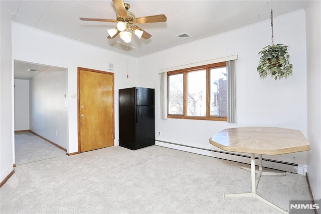 interior space featuring ceiling fan, light colored carpet, ornamental molding, and a baseboard heating unit