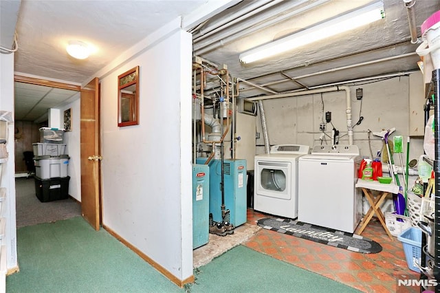 washroom with washing machine and clothes dryer