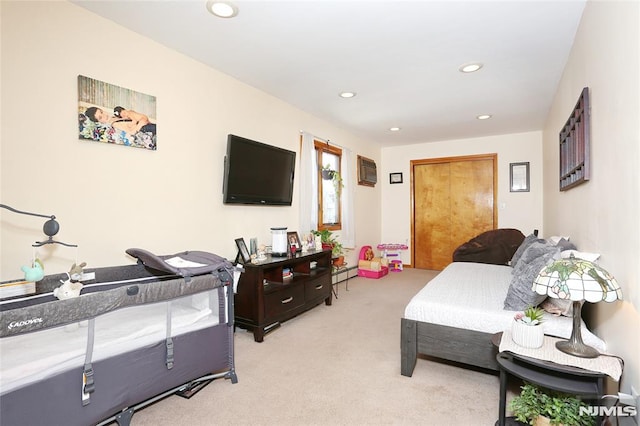 living room with a baseboard radiator and light colored carpet