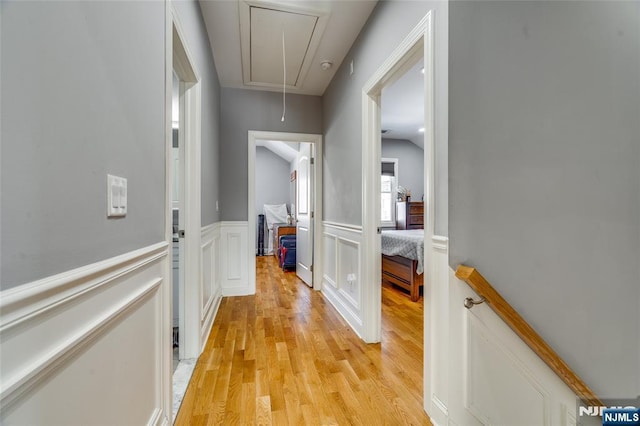 hallway with light hardwood / wood-style flooring