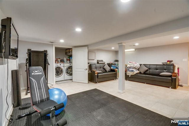 exercise room featuring washer and clothes dryer