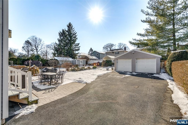 exterior space featuring a garage and a patio area