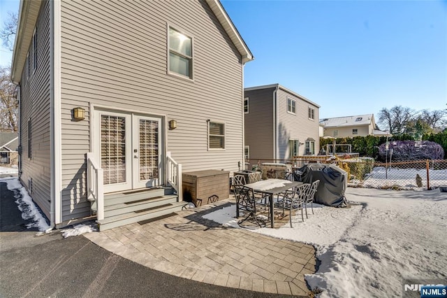 rear view of house featuring french doors and a patio