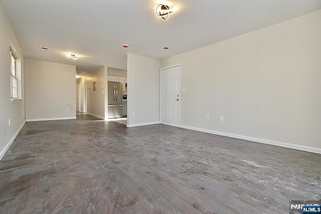 spare room featuring dark hardwood / wood-style floors