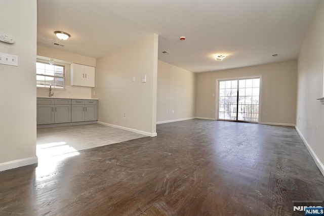 unfurnished living room with plenty of natural light