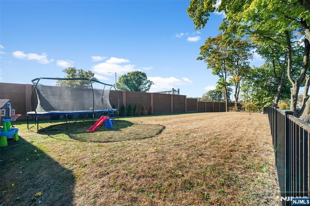 view of yard featuring a trampoline