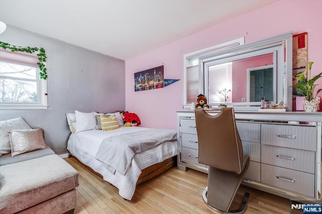 bedroom with light wood-type flooring