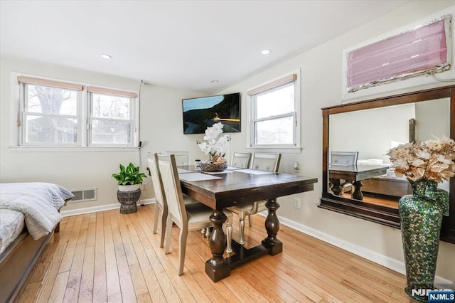 dining area with light wood-type flooring