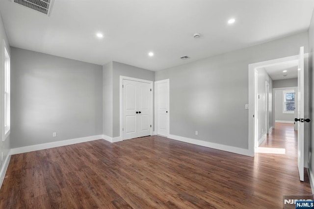 empty room featuring dark hardwood / wood-style floors